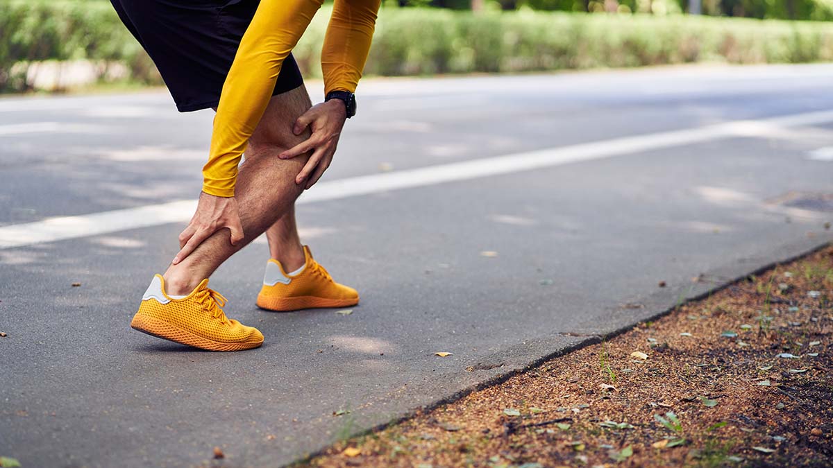 Achilles tendon pain injury in runners concept.